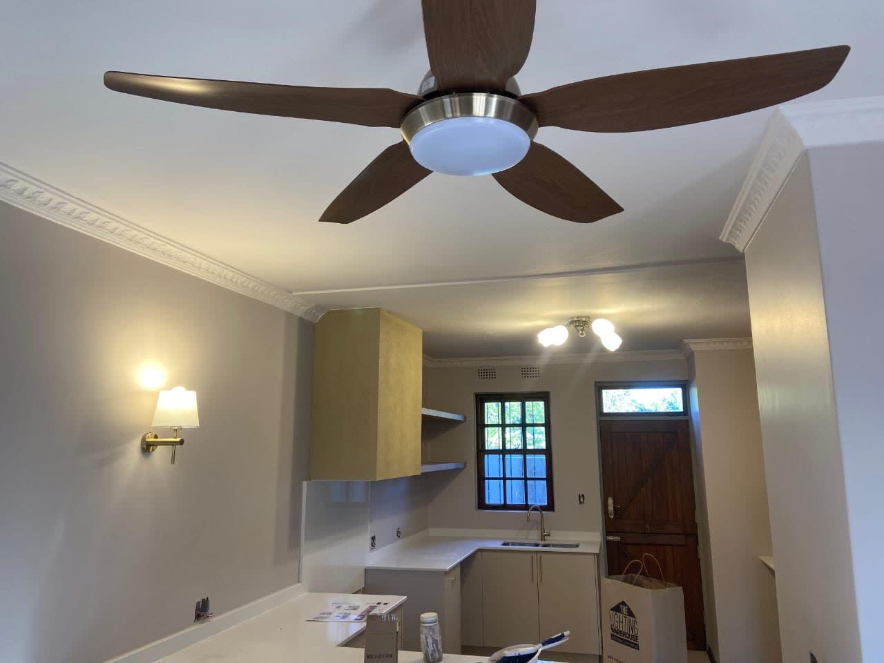Ceiling fan with LED light and kitchen wall lights installed and wired by Happ's Electrical