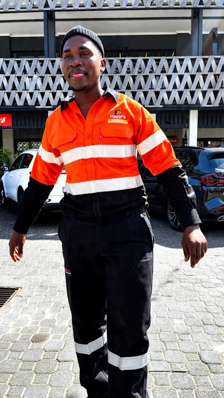 Happ's Electrical technician in branded high-visibility orange and navy uniform