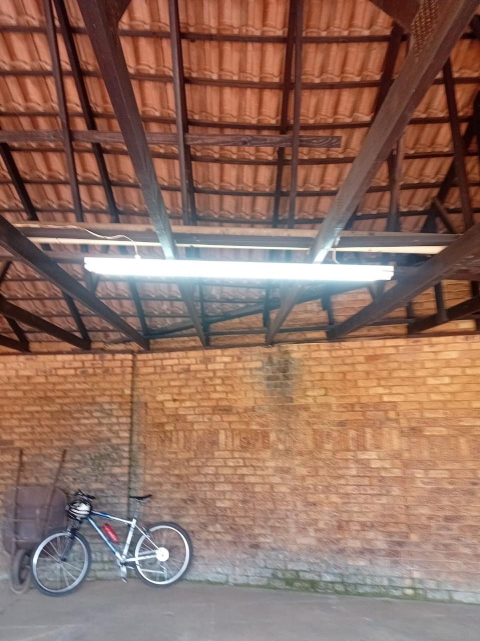 Fluorescent tube light fitted under a tiled roof in a garage and carport by Happ's Electrical