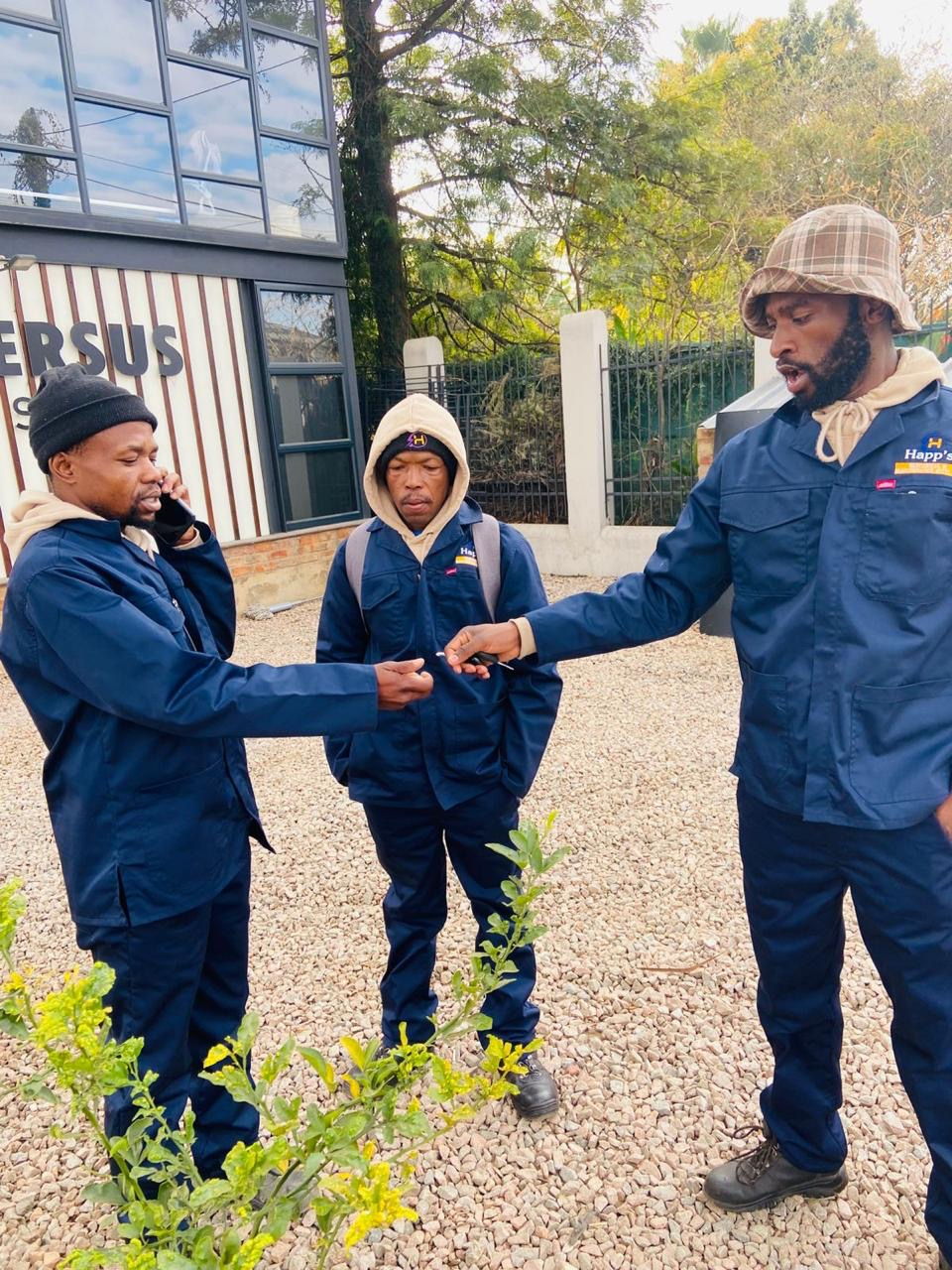 The Happ's Electrical & Maintenance team in branded navy overalls on site in Gauteng